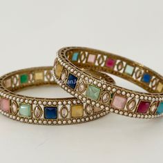 A Pair of Navratan Polki Stone bangles, Antique Dull gold bangles,Indian Kada bangles, Wedding Jewelry,Punjabi Jewelry, Bollywood bangles Made from High-Quality Hand Picked Kundan Stone Highest quality and craftsmanship Ready to ship from California in 1 business day. To measure the size of the bangle: Please refer to the size guide in the picture above. Don't hesitate to get in touch with us This is 100% Handmade jewelry. So Color, shades, and texture displayed may slightly vary from the actual product due to digital image limitations. We request you consider these minor variations. Please expect the possibility of some slight imperfections when buying handmade jewelry. If you have any questions, please message or email us. Arrives in a gift box. Thank you so much for visiting my shop Festive Bridal Bangle Sets With Stone Work, Gold Bollywood Bangle For Navratri, Multicolor Gota Work Bangle For Festivals, Festive Multicolor Bracelets With Gota Work, Multicolor Cutdana Bangle, Festive Bridal Bangle Sets For Diwali, Multicolor Stone Work Bangle As A Gift, Multicolor Cutdana Bracelets For Navratri, Bollywood Style Bangle With Stone Work