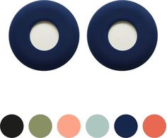 two pairs of blue and black rubber ear plugs with different colored circles around them