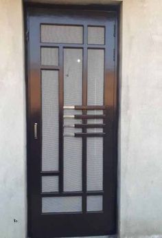 a black door with glass and metal bars