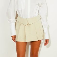 This Mini Skirt From Lioness Is Made In A Beige Lightweight Non-Stretch Twill, And Features A Low-Rise, A Fold-Over Envelope-Style Waistband, A Front Zipper And Hook Closure, Belt Loops, Slanted Side Pockets With Exposed White Lining, And Is Pleated Throughout. Condition: New With Tags. Size: Xs Approximate Measurements: Waist: 14.75" (37.5 Cm) Length: 11.75" (30 Cm) Composition: 100% Cotton. 23 Outfit, Pleated Skirt, Front Zipper, Low Rise, Mini Skirt, Outfit Ideas, Womens Skirt, Mini Skirts, Envelope