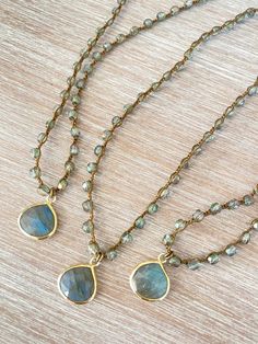 Denim crystal with a sparkly sheen paired with a lovely drop of faceted labradorite set in vermeil. Labradorite Necklace is 17.5�” long with button and loop toggle closure. You can add a touch of elegance and sparkle to any outfit with the Denim crystal and faceted labradorite necklace. Adjustable Gold Necklace With Gemstone Accents, Gold Teardrop Necklace With Gemstone Accents, Gold Bohemian Briolette Crystal Necklace, Gold Faceted Labradorite Necklaces, Gold Labradorite Necklace With Gemstone Beads, Handmade Labradorite Drop Necklaces, Handmade Drop-shaped Labradorite Necklaces, Gold Labradorite Jewelry With Gemstone Accents, Gold Faceted Labradorite Necklace