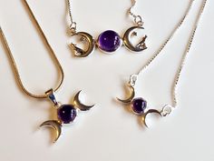 Sterling Silver and Amethyst Moon Phases Necklaces Add a sterling silver chain; https://www.etsy.com/uk/listing/1667095658/sterling-silver-925-necklace-chains-16?click_key=ff3e6eb5fd7cf517475f47dec03b257a09e4313e%3A1667095658&click_sum=8159b36d&ga_search_query=silver%2Bchains&ref=shop_items_search_14&pro=1&frs=1&sts=1     Design 1: This elegant necklace features a captivating triple moon design with an enchanting amethyst gemstone at its center. Measuring 3 cm (1.2 inches) wide, it beautifully c Silver Amethyst Moon Phase Jewelry, Silver Amethyst Jewelry With Moon Phase, Silver Amethyst Necklace With Moon Charm, Purple Moon Phase Necklace For Gifts, Crescent-shaped Purple Jewelry For Gifts, Moon Christmas, Witch Pendant, Moon Necklaces, Moon Phases Necklace