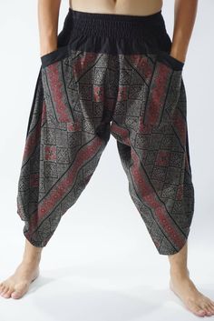 "Male Model Tall 5'9\" Waist 34\" Samurai Pants - elastic waistband and cuffs - Fits all! Unisex pants These beautiful casual pants is unique & comfortable to wear Handmade with a very lovely pattern, it is easy to wear and great for many occasions. One size fits most. These pants are great for many different activities like traveling, dancing, going to festivals, rock climbing, yoga, meditation, massage, working out, martial arts, Taichi MATERIAL: 100% Cotton APPROX MEASUREMENT: Waist: 24\" Harem Bottoms For Yoga And Festivals, Harem Yoga Bottoms For Festivals, Festival Harem Pants With Elastic Waistband, Stretch Harem Pants With Pockets For Festival, Stretch Harem Pants With Elastic Waistband For Festival, Wide Leg Pants With Elastic Waistband For Festivals, Black Hippie Bottoms With Elastic Waistband, Black Hippie Long Pants, Harem Pants With Pockets For Festivals