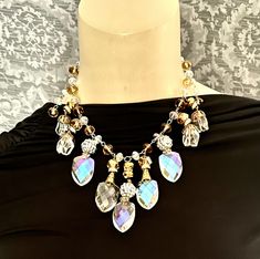 "Not for the timid, this assemblage necklace features large glass iridescent AB crystals, rhinestones, topaz beads, silver toned chain. Necklace can be adjusted by hooking into the chain, and earrings can be converted to posts or clip ons. CONDITION - excellent SIZE /MEASUREMENTS - Necklace can be adjusted to 19\",  centerpiece drop is 3\", earrings are 2\" long MATERIALS: Czech glass, glass, chain ERA - 1940s-contemporary                                                                                                                        I have been creating one of a kind jewelry for 40 years now, utilizing only the best in vintage and antique components, c. 1850s - 1960s. Enjoy ! My items are described to the very best of my ability & knowledge (and over 40 years experience in vintage a Iridescent Crystal Necklaces For Party, Elegant Iridescent Necklace For Parties, Elegant Iridescent Crystal Necklaces, Elegant Iridescent Crystal Necklace, 3 Earrings, Deco Dress, Dress Clips, Art Deco Dress, Assemblage Necklace