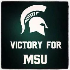 the victory for msu sign is lit up in green and white with a spartan helmet on it