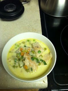 a bowl of soup sitting on top of a counter