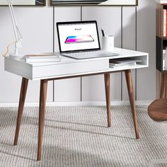 PRICES MAY VARY. ✅【Wide Desktop Area and Large Storage Space 】Overall dimensions are 42.5x19.7x29.5inch, large desktop allows you to put more items. The white writing desk with a cable grommet, making your desktop perfectly organized. The writing desk has hidden drawers with wave-shaped panels and handleless drawers, a stylish design, and a large storage space. ✅【Sturdy and Durable Mid Century Modern Desk】 Four solid wood legs of the writing desk structurally stable leg frame, reinforcing the wh Small Wood Desk, Simple Computer Desk, White Writing Desk, Wood Office Desk, Desk With Drawer, Small Office Desk, Mid Century Modern Desk, Writing Desk With Drawers, Desks For Small Spaces