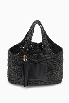 Our Kamari Tote is a refined, everyday bag made all the more elegant thanks to subtle detailing. Hand-woven from black raffia, it has a roomy interior that’s unlined to maintain its drapey silhouette and has two top handles you can easily slip over your shoulder. A whipstitched-trimmed leather pocket on the outside secures smaller items, while the leather tassel with antique brass ring adds an elevated touch. Composition: 100% Polypropene Pair with the Antilles Maillot to complete the look. Nyc Boutiques, What Women Want, Leather Pocket, Woven Tote Bag, Woven Raffia, Crochet Bags, Handbag Shoes, Leather Tassel, Everyday Bag