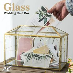 The Handmade Geometric Glass Card Box is an exquisite, one-of-a-kind creation that adds both elegance and functionality to any wedding reception or special event. 🌸✨ Carefully handcrafted with clear glass panels and framed by sleek metal in a modern, geometric design, this card box perfectly blends simplicity with sophistication. The transparent glass allows guests to see the cards inside, creating a beautiful visual display that adds a touch of charm to your event decor. 💫 Size; 🌸 Size 10.2 Glass Wedding Card Box, Card Box For Wedding, Gold Card Box, Glass Display Box, Box With Lock, Wedding Card Box, Decorative Storage Boxes, Geometric Terrarium, Gift Card Boxes