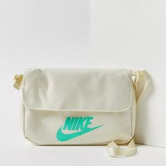 Nwot Urban Outfitters Nike Sportswear Futura 365 Crossbody Bag- This Upgraded Heritage Favorite From Nike Is Made With At Least 75% Recycled Polyester Fibers. Messenger-Style Bag With A Magnetic Flap Closure Provides Quick Access To Your Essentials, With An Internal Stash Pocket And Zippered Back Pocket. Premium Shoulder Strap Provides Styling And Fit Options. Content + Care - 100% Polyester - Spot Clean - Imported Size - Length: 9” - Width: 2” - Height: 6” Tag Has Been Marked To Prevent In Stor Nike Hip Pack, Nike Belt Bag, Nike Shoulder Bag, Nike Crossbody Bag, Nike Purses, Leopard Nikes, Nike Neon, Nike Bags, Pink Crossbody Bag