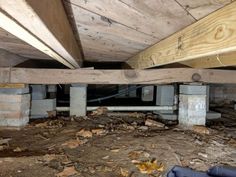 the inside of an unfinished house with exposed pipes and wood beams on the ceiling, under construction