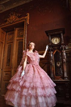 This dress is done after original 1860s paterns and can be worn as a ball or evening gown for the American Civil War events. Fluffy rose volants and ruffles are decorated by the same fabric trim, which make alltogether an impression of endless shady rose waves. The outfit consists of bodice, 7-layered rose skirt and plain white cotton petticoat with 1 row ruffle. The bodice is laced on back and decorated with three bow-knots, layers of lace and main rose fabric. It also has small sleeves. The bo Werebat Vampire, Lotr Boromir, Ball Gown Victorian, Victorian Crinoline, Victorian Dress Gown, Gown Victorian, Victorian Ball Gowns, Southern Dresses, Southern Belle Dress