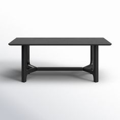 a black table sitting on top of a white floor