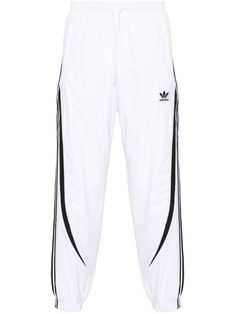 white/black recycled polyamide signature 3-Stripes logo elasticated waistband signature trefoil logo detail two side zip-fastening pockets tapered leg elasticated ankles full lining drawstring fastening This item is made from at least 50% recycled or upcycled materials. For recycled synthetic clothing products, we highly recommend using a microfibre-catching washing bag to ensure that no microplastics that can pollute water are released in the process. Learn more about what makes a product Conscious on our Conscious Criteria page Adidas Sporty Sweatpants With Three Stripes, Adidas Sportswear Sweatpants With Three Stripes, Adidas Jogging Pants With Three Stripes, Adidas Sweatpants With Side Stripes For Sports, Adidas Sweatpants For Streetwear, Adidas Athleisure Joggers With Logo, Adidas Sportswear Sweatpants For Streetwear, Sporty Adidas Sweatpants With Logo, Adidas Sporty Sweatpants With Logo