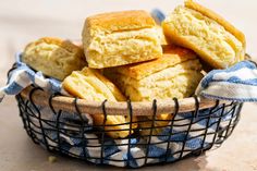 a basket full of biscuits sitting on top of a table