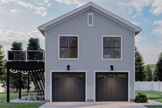 a two story house with three garages and a deck on the top floor is shown