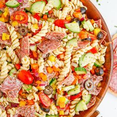 a pasta salad with meat, cheese and vegetables