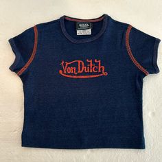 Bought Several Of These New But No Tag - Navy Denim Look W/Orange Lettering And Stich Von Dutch Originals Toddler Shirts. 100% Cotton And Made In The Usa! Please Feel Free To Ask Questions Smoke-Free Home Offers Welcome!! Von Dutch Shirt, Dutch Blue, Von Dutch, Fancy Dresses, Shirts & Tops, Blue Orange, Wearable Art, Kids Shirts, Shirts Tops