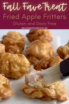 fried apple fritters on a white plate with a spatula in the middle