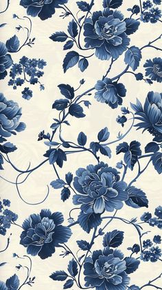 a blue and white wallpaper with flowers on it