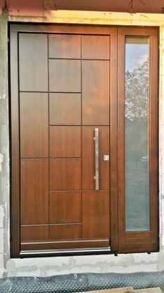 a wooden door with glass on the outside