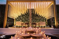 an outdoor wedding setup with candles and decorations