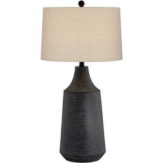 a black table lamp with a white shade on it's base and a beige linen lampshade