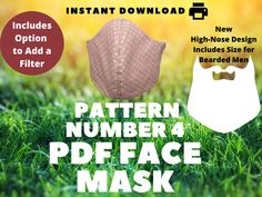 the pattern number 4 face mask is shown in front of green grass and yellow background