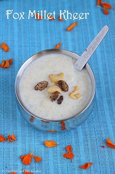 a bowl filled with oatmeal and nuts on top of a blue table cloth