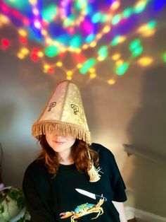 This handmade lampshade hat is a one of a kind, meme cuisine original! This funny and unique LED costume hat makes the perfect accessory for raves, festivals, costume parties, and more. This novelty hat comes with a built in LED disco ball light. This sound activated party light is attached to the top of the bucket hat via velcro, so it is removable. It is lightweight and comfortable, and shines through the fabric of the hat. It projects rainbow patterns onto the ceiling, and changes to the beat of the music (see video). It is rechargeable with a micro USB cable, which is included. Light lasts around 4 hours. Charge time is 1-1.5 hours Light dimensions are 5.5cm x 5.5cm x 5.5cm **Pull cord is NON FUNCTIONAL! The light is turned on/off with a button on the side CONSTRUCTION: The hat is buil Disco Ball Hat, Lampshade Hat, Kind Meme, Disco Ball Light, Led Costume, Novelty Hats, Costume Parties, Cooling Blanket, Pink Leopard Print