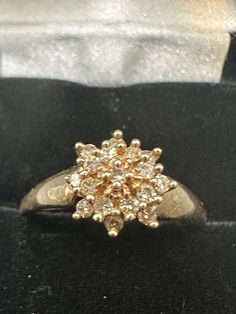 "A unique 10K yellow gold diamond cluster ring for your consideration. This wonderful ring is hallmarked 10K and guaranteed to be such.  It also features a maker's mark \"SJ\".  The ring features a traditional cluster setting with 16 I quality 1-2-point diamonds. The heavy prongs make the clusters look make the champagne diamonds but they are not. The total carat weight is approximately 1/4 carat of diamonds.  The ring measures 9mm in diameter. It is a size 8 1/4 and weighs in at 1.7 grams.  It's an all around gorgeous ring!" Heirloom 14k Cluster Diamond Ring, Anniversary Cluster Ring Stamped 14k, Cluster Diamond Ring Stamped 14k Gold, 14k Gold Cluster Ring For Formal Occasions, 14k Gold Cluster Ring Hallmarked, Gold Collectible Cluster Ring, Antique 14k Gold Cluster Ring, Antique Yellow Gold Cluster Ring, Luxury Vintage Gold Cluster Ring