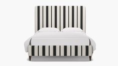 a bed with black and white striped headboard on top of it's frame