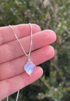 This unique healing crystal necklace is perfect for helping with anxiety and stress relief. Moonstone is a unique gemstone for calming and grounding. It's perfect for meditation and getting back to your own wisdom. Our exclusive, Rainbow Moonstone gemstone necklace is a perfect addition to any wardrobe. The gemstone pendant is a unique, leaf style shape with iridescent colors. The crystal gemstone is wire wrapped by hand and is carried by a genuine .925 sterling silver box style chain.  A spring ring clasp secures the chain.  All together creating a perfect piece for you or that special someone.  About the Gemstone:  ✨Moonstone is a very beautiful gemstone created by nature. Here at Rachel Dunn Jewelry we use only high quality Moonstones in our pieces.  ✨Moonstone is believed by ancient cu Moonstone Pendant Necklace, Personalized Pendant, Moonstone Necklace, Silver Box, Unique Handmade Jewelry, Moonstone Pendant, Unique Gemstones, Gorgeous Necklaces, Healing Crystal