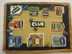 a cake that is shaped to look like a board game with various items on it