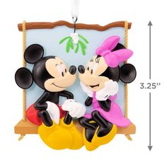 mickey and minnie mouse ornament hanging on wall