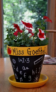 a potted plant sitting on top of a wooden table