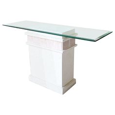 a white pedestal with a glass top