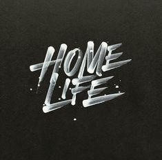 the words home life written in white spray paint