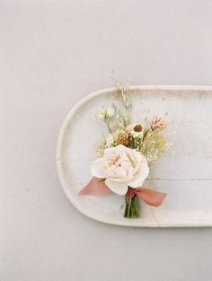 a white tray with flowers on it