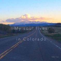 an empty road with the words my soul lives in colorado