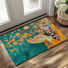 a door mat with an image of a woman's hand holding a flower on it