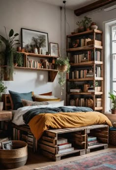 a bedroom with lots of bookshelves and plants on the shelves above the bed