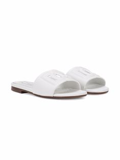 White calf leather DG logo leather sandals from DOLCE & GABBANA KIDS featuring tonal stitching, cut-out detailing, open toe, branded insole and flat rubber sole. | Dolce & Gabbana Children DG logo leather sandals