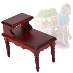 a small wooden table with a doll house in the background