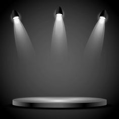 three spotlights shine brightly on a black background with a round base and two lights at the top