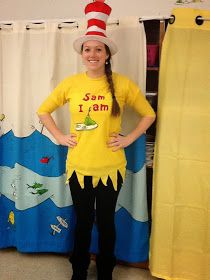 a girl wearing a cat in the hat costume