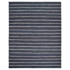 a blue and white striped rug on a white background