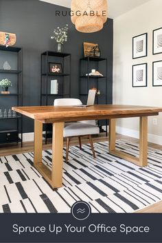 the dining room table is made from wood and has white chairs, black walls, and an area rug