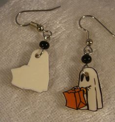 "These adorable light weight earrings feature print art of a ghost trick or treating. Handmade Altered art Made with acrylic, resin and stainless steel connectors and surgical steel ear wire. Highlighted with glass beads. Measure slightly over 1 1/4\" long Pay one low shipping price for all items ordered. US orders ship for $3.50 Visit www.afanaffair.com or the 'Wearable Memories' shop section on Etsy to find out how to put your own photos on jewelry Like us on facebook for money saving coupons Fun White Halloween Earrings, Hypoallergenic White Jewelry For Halloween, Halloween Themed White Earrings, Spooky White Halloween Jewelry, Fun White Halloween Jewelry, Fun White Jewelry For Halloween, Fun Hand Painted White Jewelry, Hand Painted White Fun Jewelry, Hand Painted White Novelty Jewelry