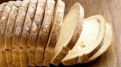 sliced bread sitting on top of a wooden table